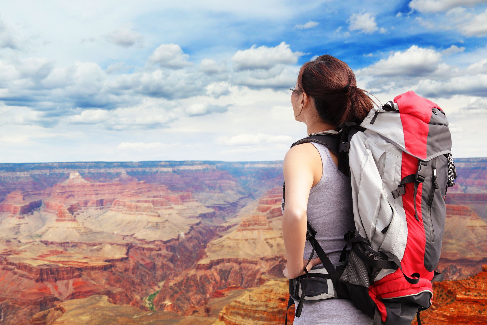 Woman mountain Hiker with backpack enjoy view in grand canyon, asian